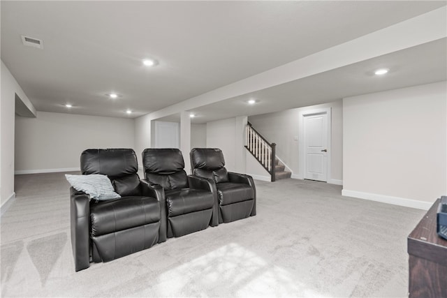 home theater with light colored carpet