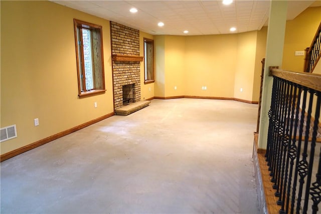 interior space featuring a paneled ceiling and a fireplace