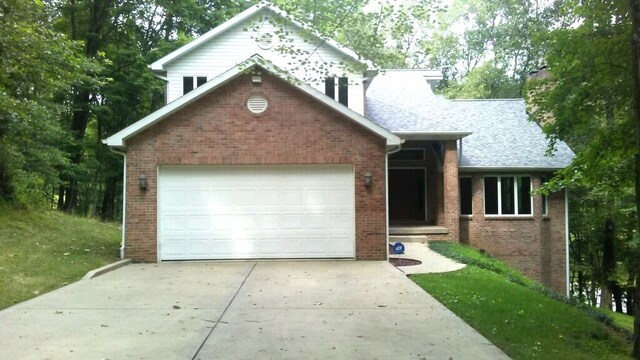 view of front of property with a garage