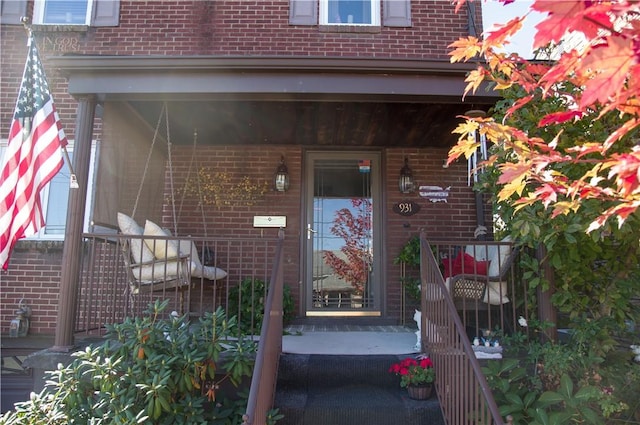 property entrance with brick siding