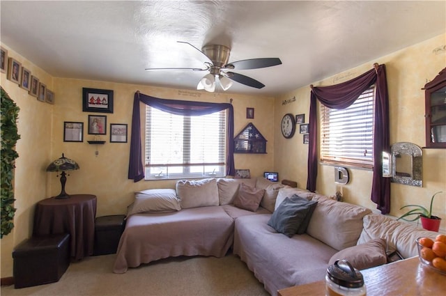 carpeted living room featuring ceiling fan