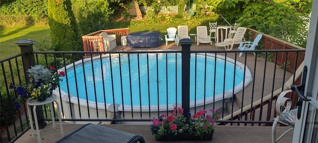 view of pool featuring a fenced in pool and a patio