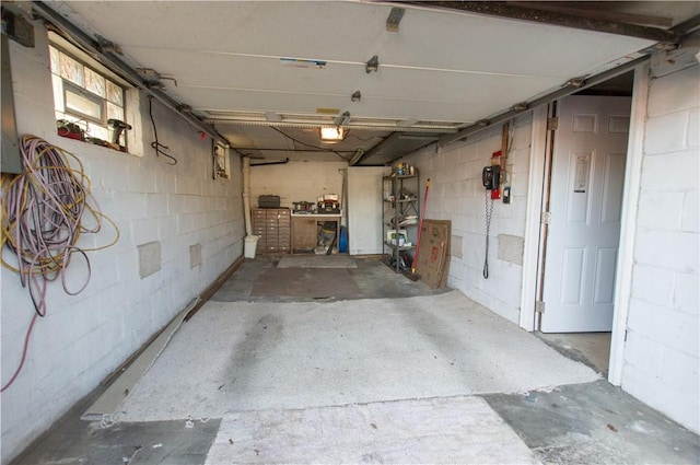 garage featuring concrete block wall