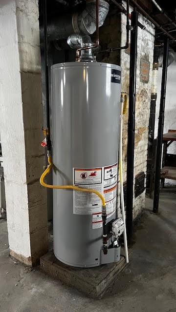 utility room with gas water heater