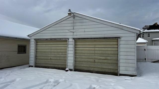 view of snow covered garage