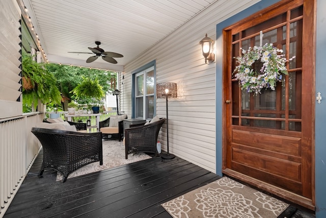 deck with ceiling fan and outdoor lounge area