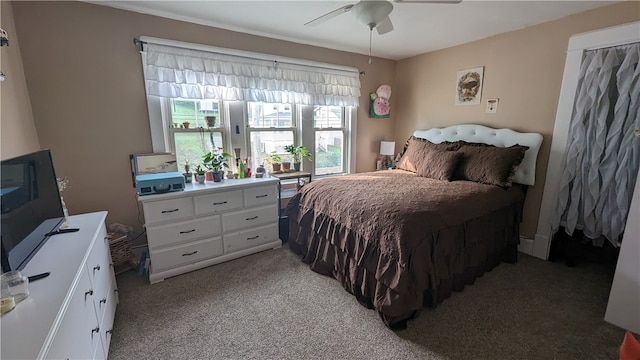 bedroom featuring ceiling fan and light colored carpet