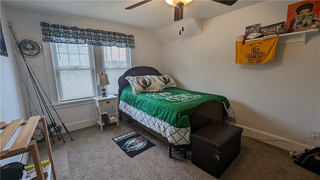 carpeted bedroom with ceiling fan and multiple windows