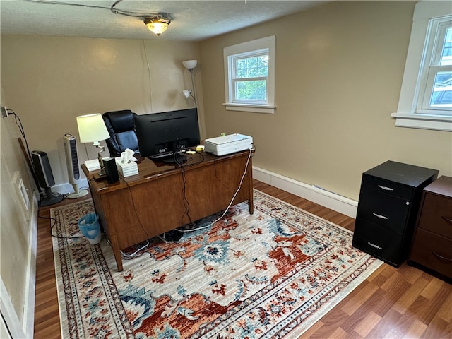 office space featuring hardwood / wood-style floors and a textured ceiling