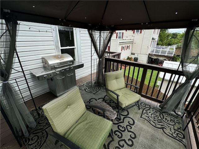 deck with a gazebo and a grill