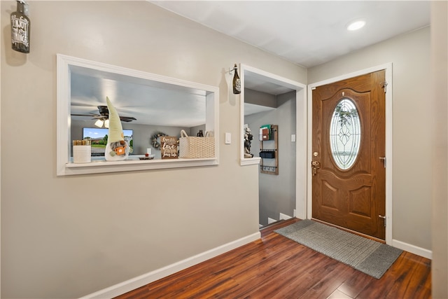 entrance foyer with ceiling fan and wood-type flooring