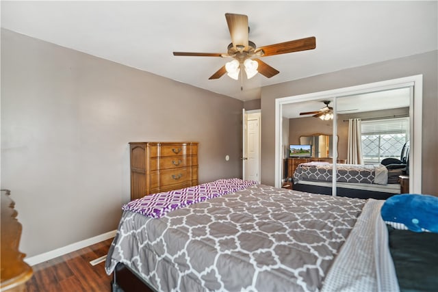 bedroom with ceiling fan, wood-type flooring, and a closet