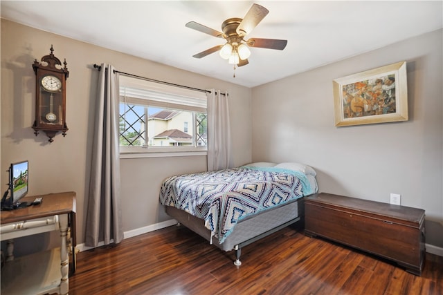 bedroom featuring ceiling fan and dark hardwood / wood-style floors