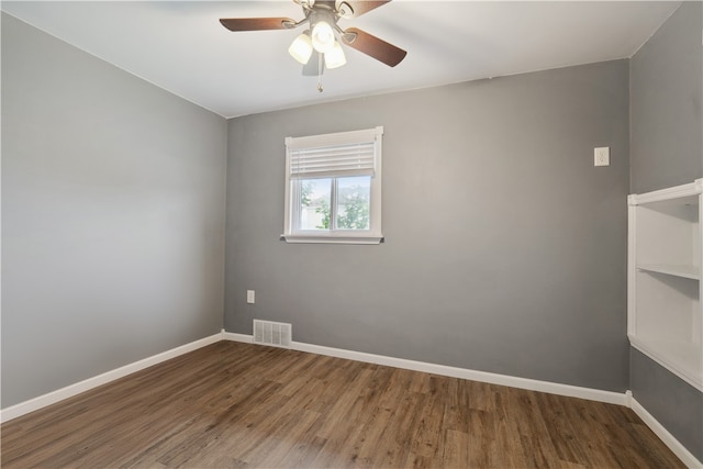 unfurnished room with ceiling fan and wood-type flooring