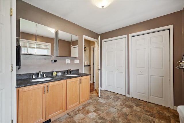 kitchen featuring light tile patterned floors, sink, and light brown cabinetry