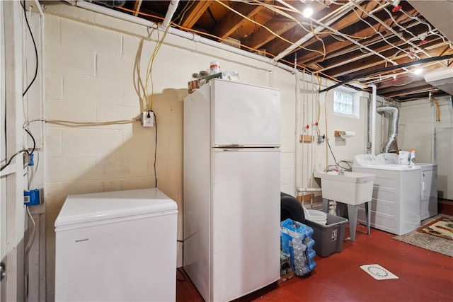 laundry room featuring independent washer and dryer and sink