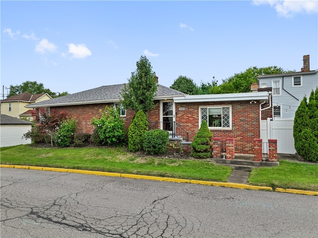 view of front of home with a front yard