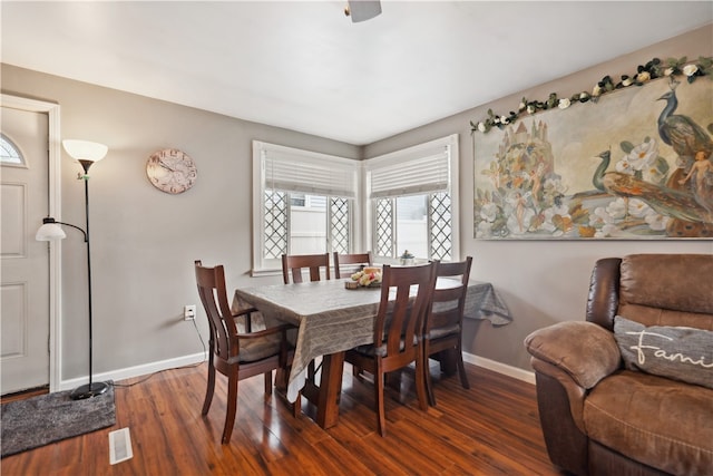 dining area with dark hardwood / wood-style flooring