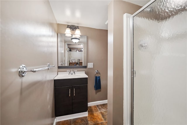 bathroom with vanity, tile patterned flooring, and an enclosed shower