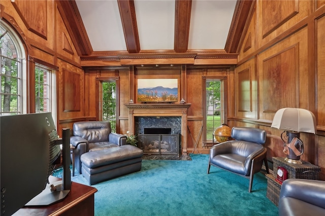 living room featuring a fireplace, carpet floors, wooden walls, and beamed ceiling