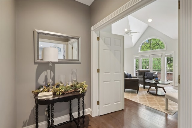 interior space with high vaulted ceiling and wood-type flooring