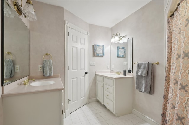 bathroom featuring double vanity and tile patterned flooring