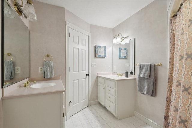 full bathroom featuring tile patterned flooring, vanity, and baseboards