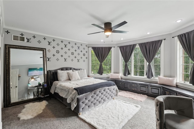 carpeted bedroom with ceiling fan, crown molding, and multiple windows