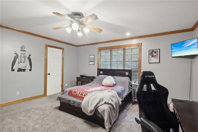 carpeted bedroom featuring ceiling fan and crown molding