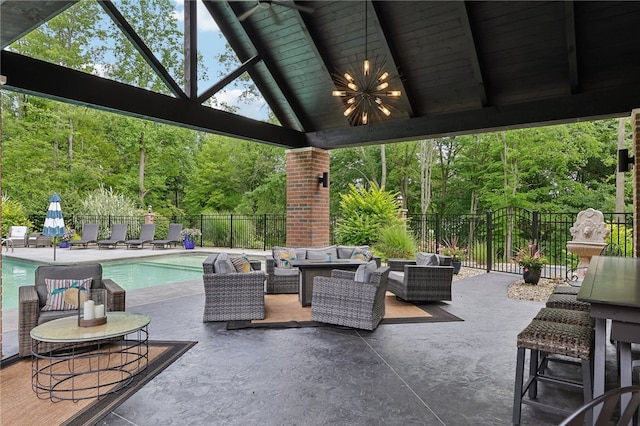 view of patio / terrace featuring a fenced in pool and an outdoor living space