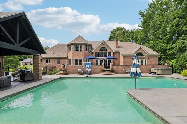 view of swimming pool with a patio