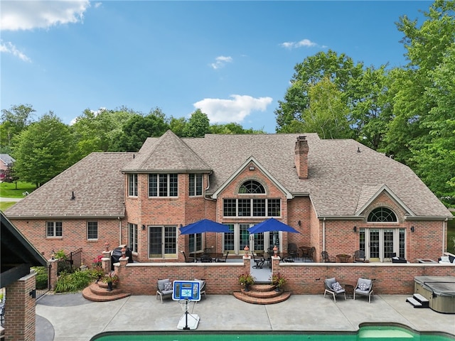 back of property with a patio area