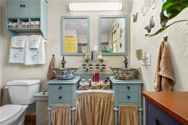 bathroom with vanity and toilet