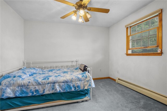 carpeted bedroom with a baseboard radiator and ceiling fan