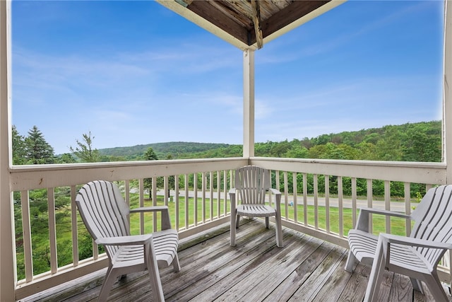 wooden terrace with a yard