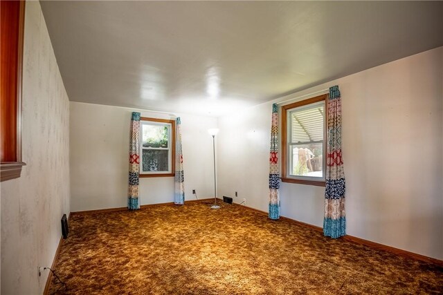 empty room featuring carpet flooring