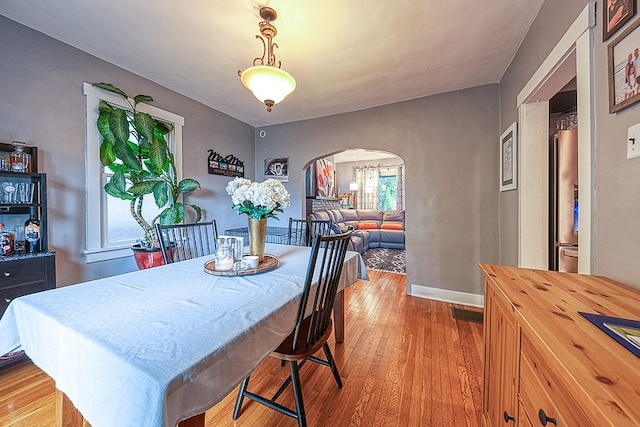 dining area featuring light wood-type flooring