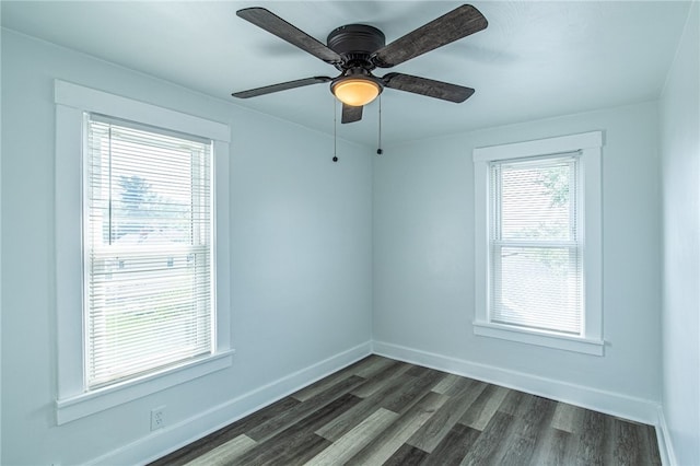 unfurnished room with ceiling fan and dark hardwood / wood-style floors