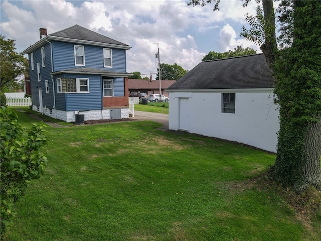 view of yard with central AC