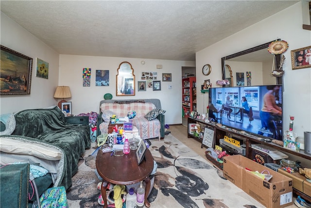 carpeted living room featuring a textured ceiling