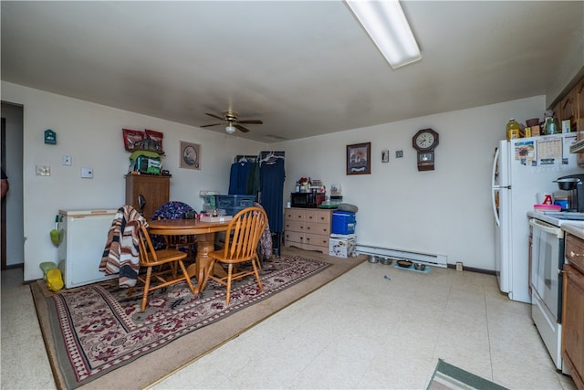 dining area featuring ceiling fan, a baseboard radiator, and light tile patterned floors