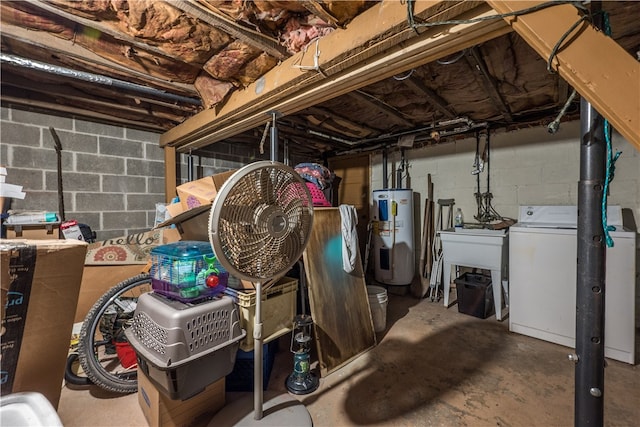 basement with water heater, sink, and washing machine and clothes dryer