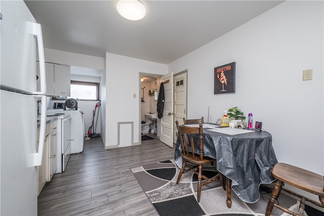 dining area with wood-type flooring