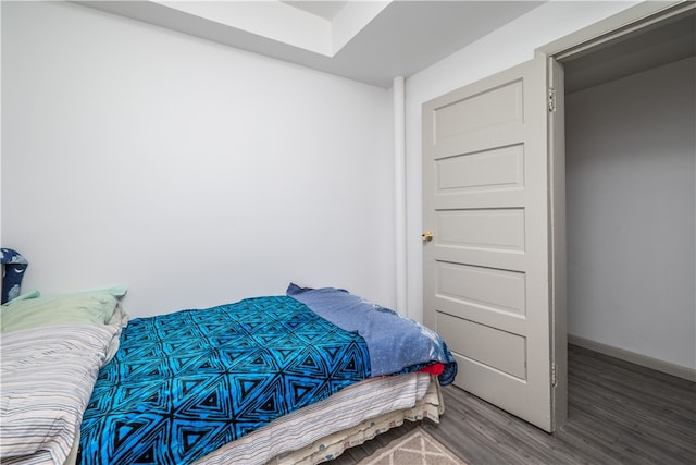 bedroom with hardwood / wood-style floors