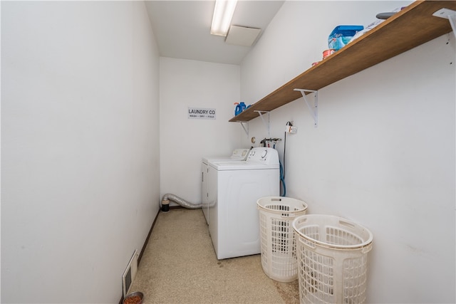 washroom featuring washer and clothes dryer