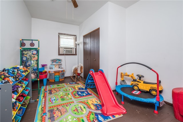 game room with ceiling fan, hardwood / wood-style flooring, and cooling unit