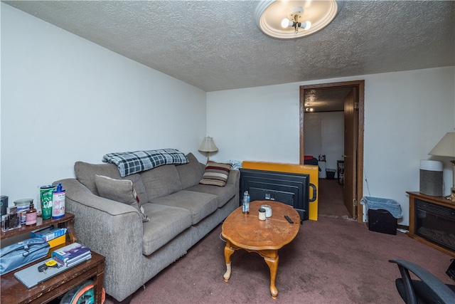 carpeted living room featuring a textured ceiling