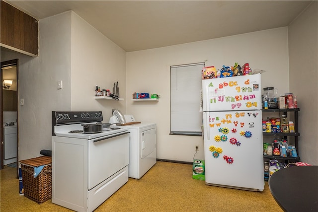 kitchen featuring white refrigerator and separate washer and dryer