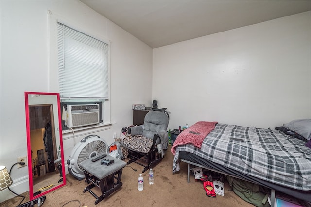 bedroom with cooling unit and carpet floors