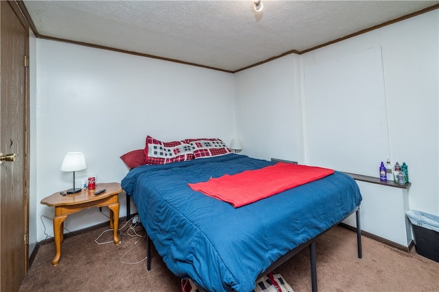 bedroom featuring a textured ceiling, carpet, and ornamental molding